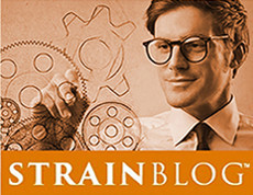 man drawing diagram of gears, STRAINBLOG logo